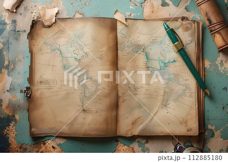 Vintage pen and old map on old paper background on table, travel concept 112885180