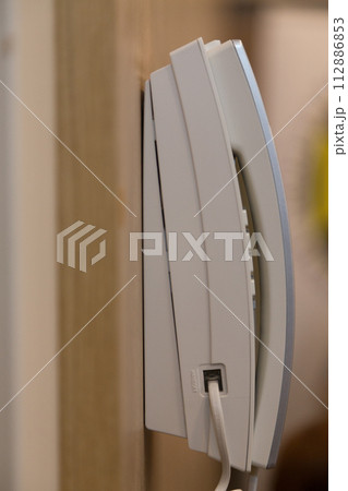 Wall-mounted telephone for calling service personnel. Wall-mounted telephone for calling service personnel. 112886853
