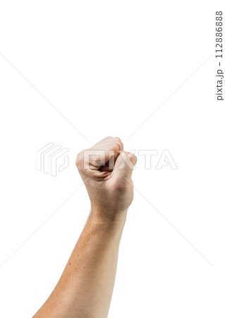 A man's hand with a fist raised in the air. A man's hand with a fist raised in the air. 112886888