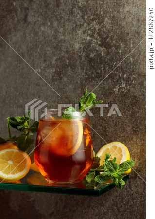 Iced tea with ice, lemon, and mint. Iced tea with ice, lemon, and mint. 112887250