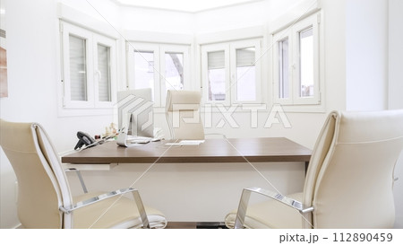 Interior of spacious doctor clinic with chairs at computer desk 112890459