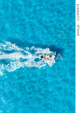 Aerial view on fast boat on blue sea at sunny day. Vacation and leisure. 112890974