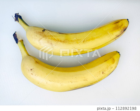 Ripe bananas. Exotic tropical yellow fruit. Banana symbol of health care and wellbeing. 112892198