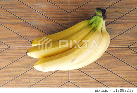 Ripe bananas. Exotic tropical yellow fruit. Banana symbol of health care and wellbeing. 112892218