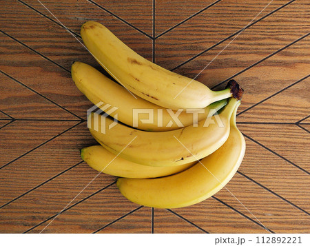 Ripe bananas. Exotic tropical yellow fruit. Banana symbol of health care and wellbeing. 112892221