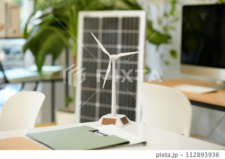 Model of wind turbine on table in renewable energy company office Model of wind turbine on table in renewable energy company office 112893936