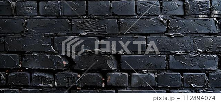 Black brick wall with cracks and scratches. Abstract texture background for design. Black brick wall with cracks and scratches. Abstract texture background for design. 112894074