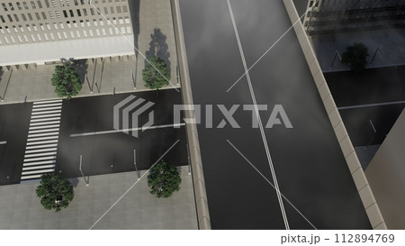 A city street with a crosswalk and a bridge in the background 112894769