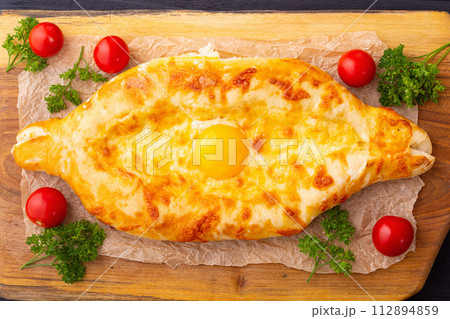 Homemade adjarian khachapuri with egg 112894859