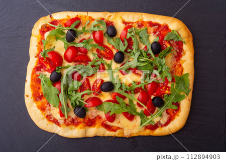 Italian pasta with shrimps , parmesan and tomatoes 112894903