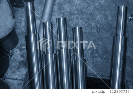 The metal shaft parts from lathe machine finish cut. The metal shaft parts from lathe machine finish cut. 112895735
