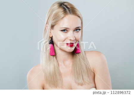 Smiling blonde person portrait. Beauty woman with clear shiny fresh skin and blond hair Smiling blonde person portrait. Beauty woman with clear shiny fresh skin and blond hair 112896372