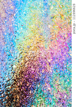 Leaked Gasoline Oil Slick or Petrol Rainbow Enviromental leak On Tarmac Road 112896628