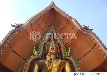 Golden huge Buddha statue is located on the top of the mountain in Thailand Golden huge Buddha statue is located on the top of the mountain in Thailand 112899559