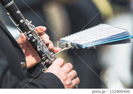 Details of hands playing the clarinet 112900400
