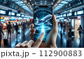 A hand holds a phone displaying a 3D airplane hologram, 112900883