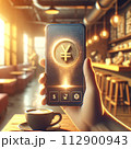 a hand holds a phone with a floating 3D yen coin hologram 112900943