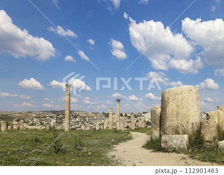 Roman ruins (against the background of a beautiful sky with clouds) in the Jordanian city of Jerash (Gerasa of Antiquity), capital and largest city of Jerash Governorate, Jordan Roman ruins (against the background of a beautiful sky with clouds) in the Jordanian city of Jerash (Gerasa of Antiquity), capital and largest city of Jerash Governorate, Jordan 112901463