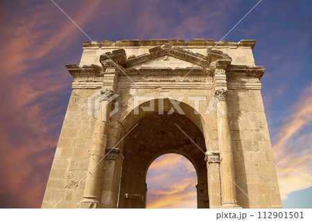Roman ruins (against the background of a beautiful sky with clouds) in the Jordanian city of Jerash (Gerasa of Antiquity), capital and largest city of Jerash Governorate, Jordan Roman ruins (against the background of a beautiful sky with clouds) in the Jordanian city of Jerash (Gerasa of Antiquity), capital and largest city of Jerash Governorate, Jordan 112901501