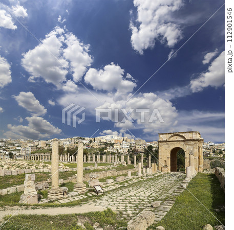 Roman ruins (against the background of a beautiful sky with clouds) in the Jordanian city of Jerash (Gerasa of Antiquity), capital and largest city of Jerash Governorate, Jordan Roman ruins (against the background of a beautiful sky with clouds) in the Jordanian city of Jerash (Gerasa of Antiquity), capital and largest city of Jerash Governorate, Jordan 112901546