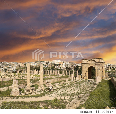 Roman ruins (against the background of a beautiful sky with clouds) in the Jordanian city of Jerash (Gerasa of Antiquity), capital and largest city of Jerash Governorate, Jordan Roman ruins (against the background of a beautiful sky with clouds) in the Jordanian city of Jerash (Gerasa of Antiquity), capital and largest city of Jerash Governorate, Jordan 112901547