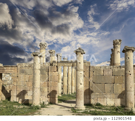 Roman ruins (against the background of a beautiful sky with clouds) in the Jordanian city of Jerash (Gerasa of Antiquity), capital and largest city of Jerash Governorate, Jordan Roman ruins (against the background of a beautiful sky with clouds) in the Jordanian city of Jerash (Gerasa of Antiquity), capital and largest city of Jerash Governorate, Jordan 112901548