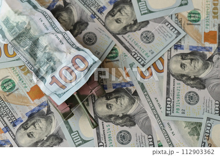 Tank on crumpled hundred dollar bills banknotes. Background of war funding and military support price for United States of America Tank on crumpled hundred dollar bills banknotes. Background of war funding and military support price for United States of America 112903362
