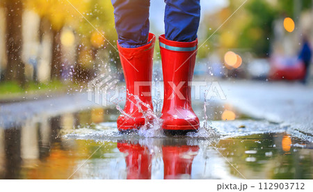 Close Up of Person Wearing Red Rain Boots. Generative AI 112903712