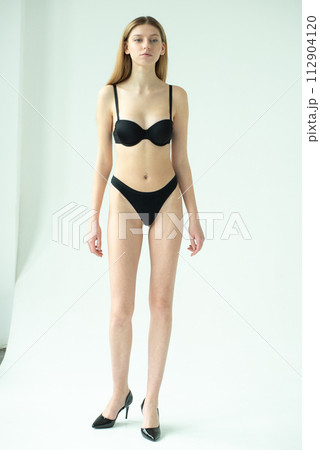 Studio model test, snap, polaroid. Beautiful young european woman on white background 112904120