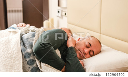 Happy gay couple sleeping relaxed at home Happy gay couple sleeping relaxed at home 112904502