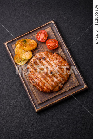 Delicious fresh grilled chicken fillet with spices and herbs 112905336