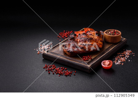 Fresh juicy delicious beef steak on a dark background 112905349