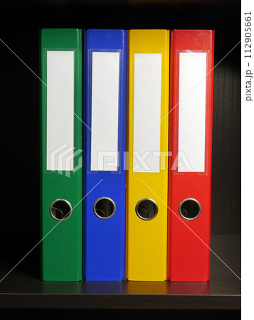 Four blank binders in green, blue, yellow and red colors Four blank binders in green, blue, yellow and red colors 112905661
