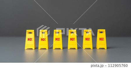 Many of signs screaming NO. An urgent prohibition to go further. Blocked path. Prohibitions and restrictions. 112905760