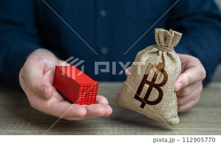 Ship container and thai baht money bag. Distribution logistics worldwide. Transportation and freight of goods and cargo through ports or overland routes. Trade and delivery. Ship container and thai baht money bag. Distribution logistics worldwide. Transportation and freight of goods and cargo through ports or overland routes. Trade and delivery. 112905770