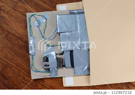 Mail bomb IED - Improvised Explosive Device with c4 and cell phone module in envelope 112907218