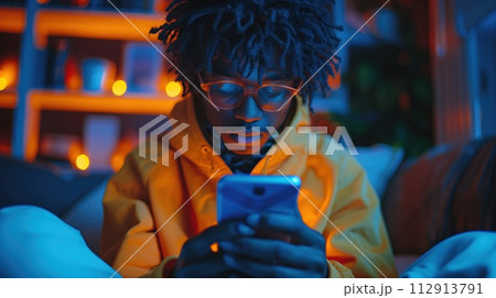 portrait of a man looking at a smartphone 112913791