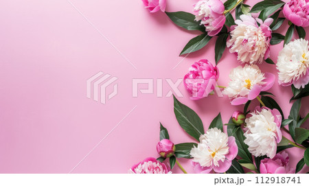 Beautiful peonies on pink background. Flat lay with space for text. Top view. 112918741