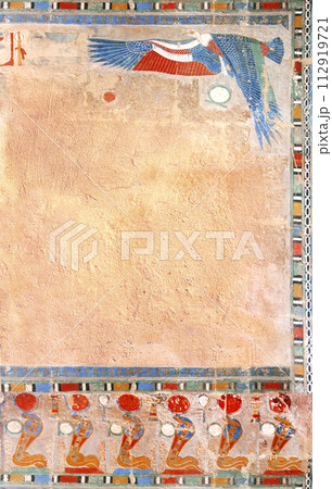 Vertical background with Ancient Egyptian Colorful Mural Wall Painting and stucco wall texture. Frame in egyptian style with Figure of eagle and cobras. Mock up template. Copy space for text 112919721