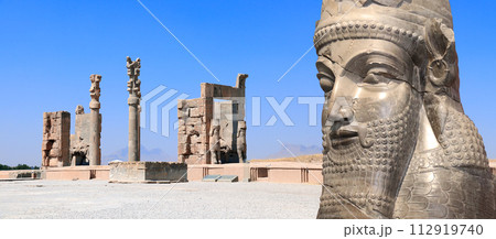 Horizontal banner with Gate of All Nations (Xerxes Gate) and face of assyrian protective deity lamassu - human-headed winged bull, Persepolis, Iran Horizontal banner with Gate of All Nations (Xerxes Gate) and face of assyrian protective deity lamassu - human-headed winged bull, Persepolis, Iran 112919740