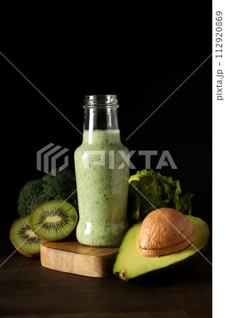 Smoothie from fresh vegetables on a dark background 112920869