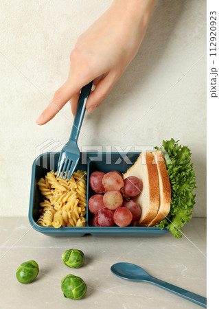 Yellow lunch box with food on a white background 112920923