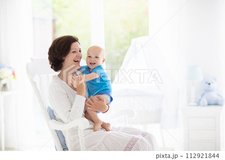 Mother and baby in bedroom 112921844