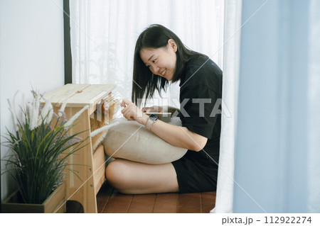 pet care concept with owner during read book and play with british cat in livingroom 112922274