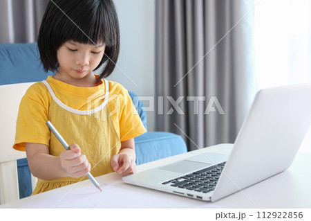little asian girl student study online using laptop computer at home little asian girl student study online using laptop computer at home 112922856