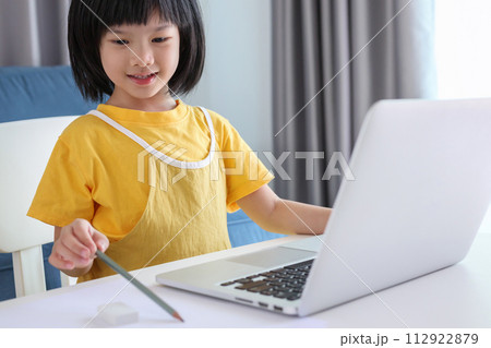 little asian girl student study online using laptop computer at home little asian girl student study online using laptop computer at home 112922879