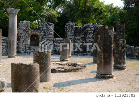 Ruins of Great Basilica in Butrint National Park, Buthrotum, Albania. Triconch Palace at Butrint Life and death of an ancient Roman house Historical medieval Venetian Tower surrounded. High quality 112923502