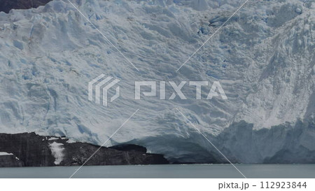 Slow Motion Glacier Calving into Ocean with Ice Splash 112923844