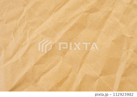 Abstract brown crumpled creased recycle paper texture background Abstract brown crumpled creased recycle paper texture background 112923982