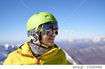 Smiling Skier with Reflective Goggles and Helmet Smiling Skier with Reflective Goggles and Helmet 112924982
